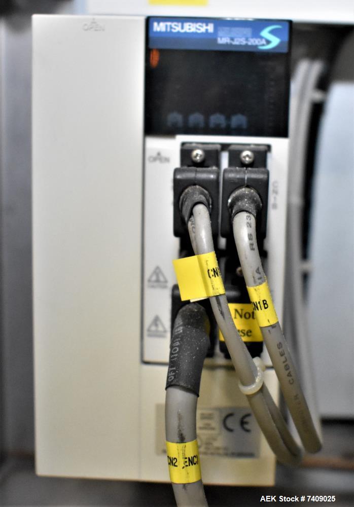 Used Leepack Servo Drive Powder Auger Feeder, Model AW-590IV. Mitsubishi model MR-JZS-200A servo drive. Foot pedal switch. Level sensor. Mounted on stainless steel frame with casters. 3/60/480 Volt.